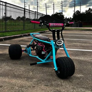 Barbie Island aqua drift trike front three-quarter view with pink accents