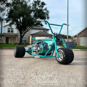 Young Dolph teal drift trike front three-quarter view